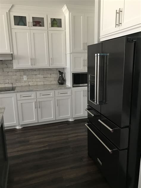 cabinets with black stainless steel appliances|white kitchen cabinets black appliances.